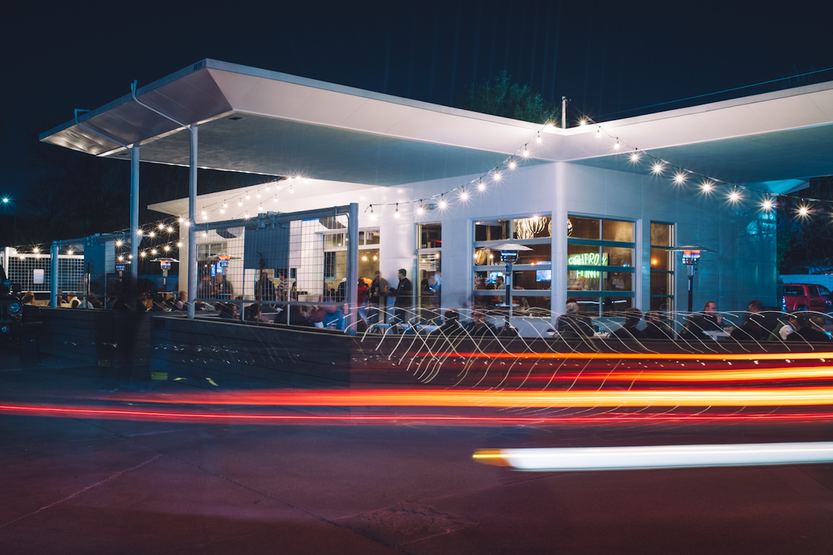 The wraparound patio at Eight Row Flint, which is housed in an old Citgo gas station. | Photo by Agricole Hospitality