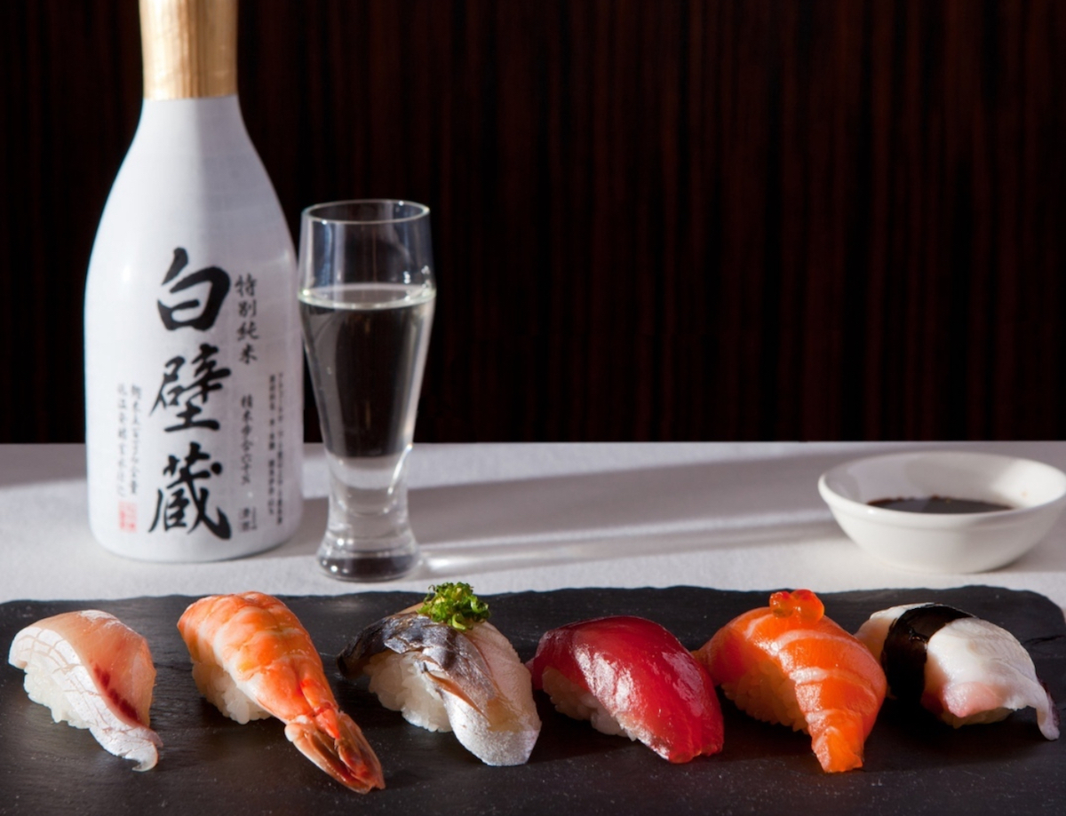 IMG_6786 - DiningOut Houston A sampling of nigiri and a bottle of sake at Uptown Sushi. | Photo by Uptown Sushi