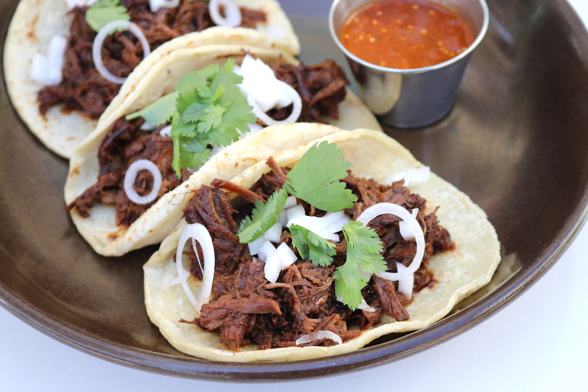 A trio of barbacoa tacos at Urbe. | Photo by H-Town Restaurant Group 