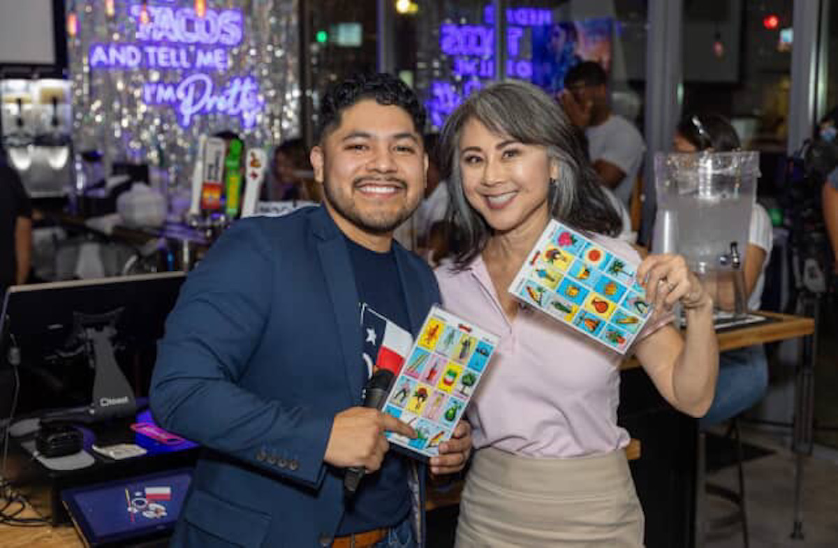 Space City Birria owner, Humberto Martinez poses with KHOU reporter, Shern Min Chow during loteria night. | Photo by Space City Birria