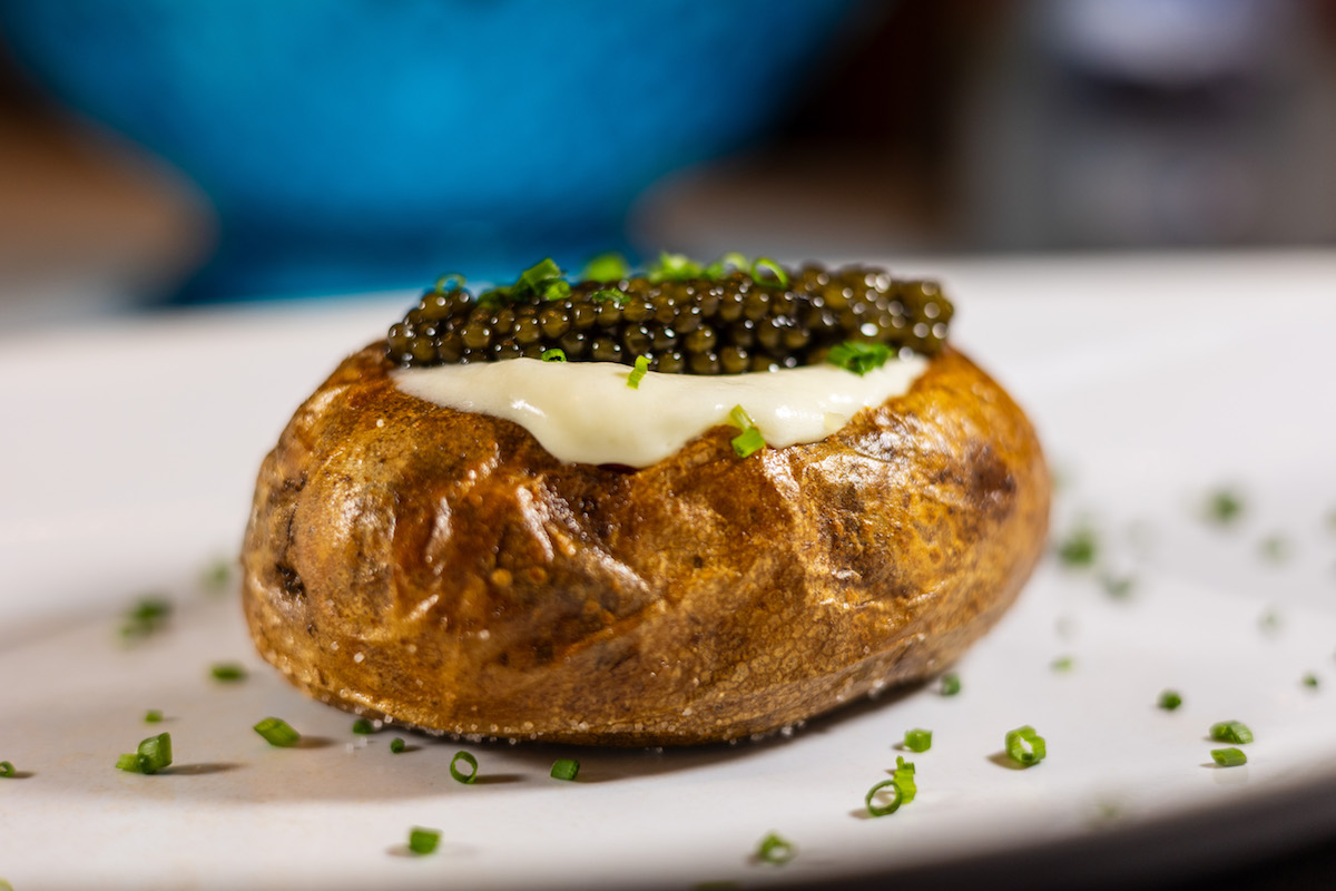Tony’s takes the humble potato to Gilded Age heights with its $250 spud topped with a king’s ransom of Kaviari Oscietra Gold. | Photo by Caroline LeGates