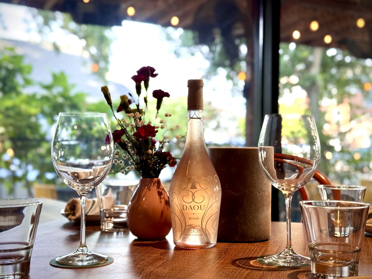 A bottle of DAOU rosè on the patio at Alora. | Photo by Alora