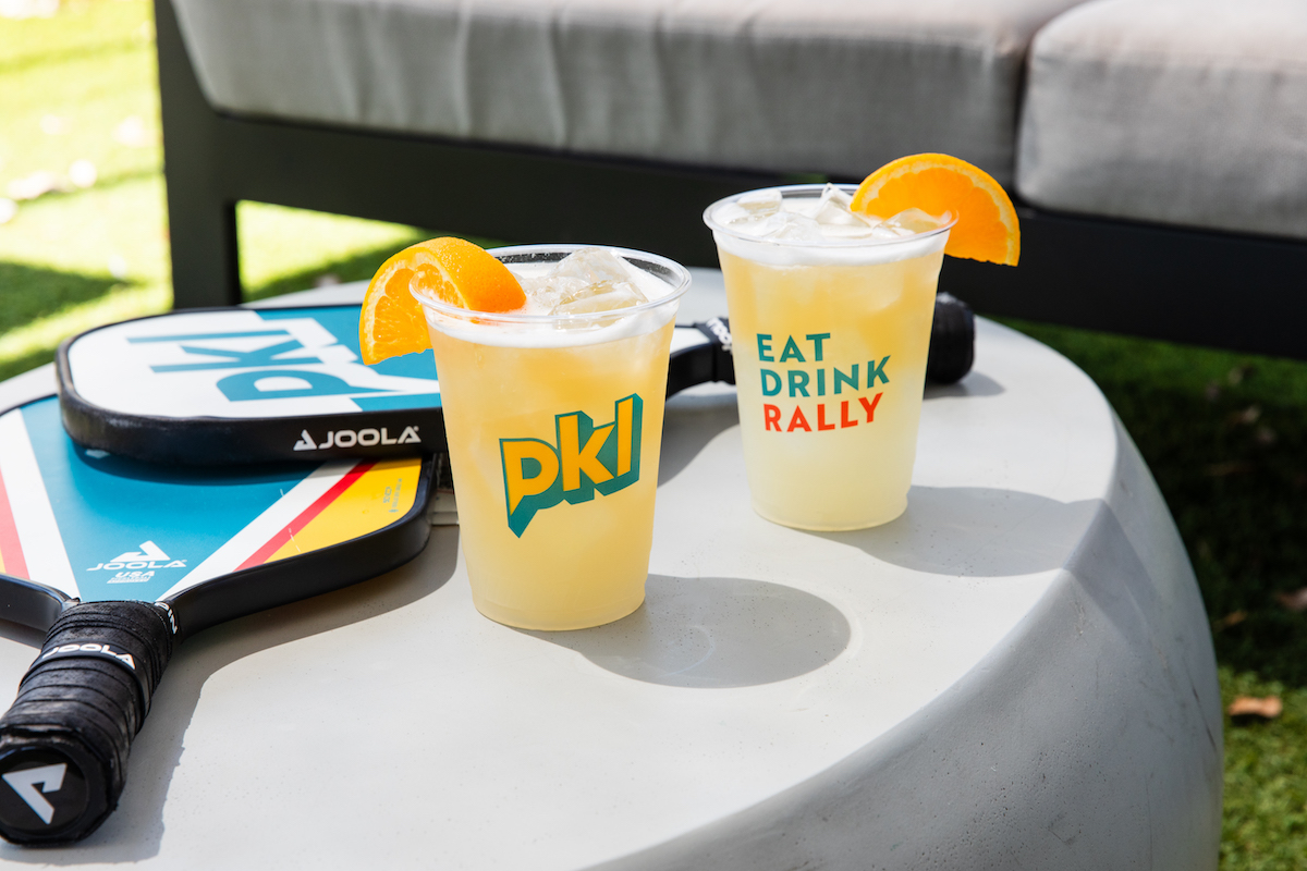 Beer and pickle ball paddles at PKL Social. | Photo by Becca Wright