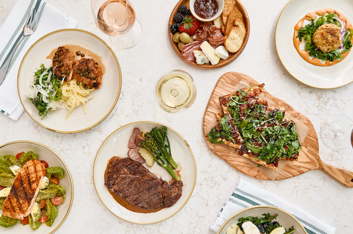 A spread of snacks, entrees, and wine at the Board Room. | Photo by Natalie Goff