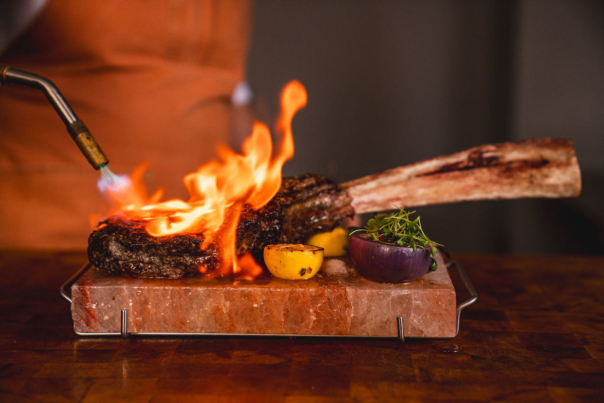 Toro Toro's tableside tomahawk service. | Photo by Four Seasons Houston