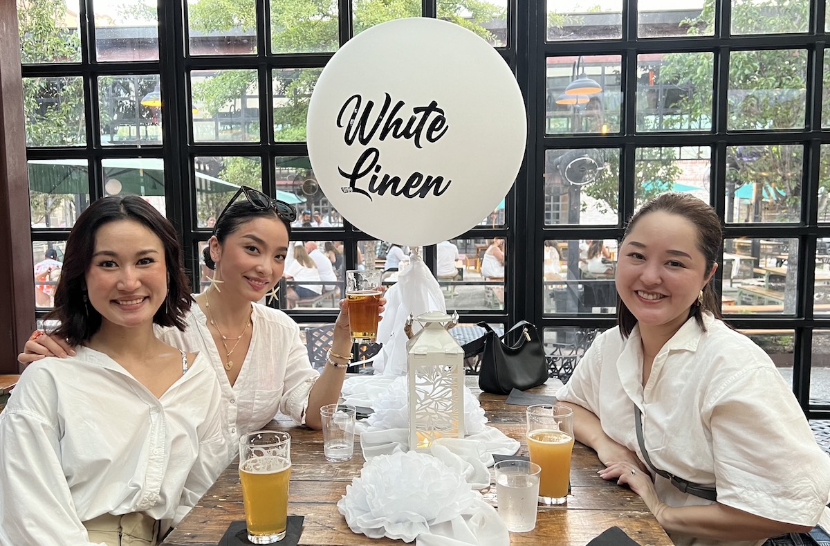 Guests enjoy White Linen Night in the Heights at Heights Bier Garten. | Photo by Emily Vitek