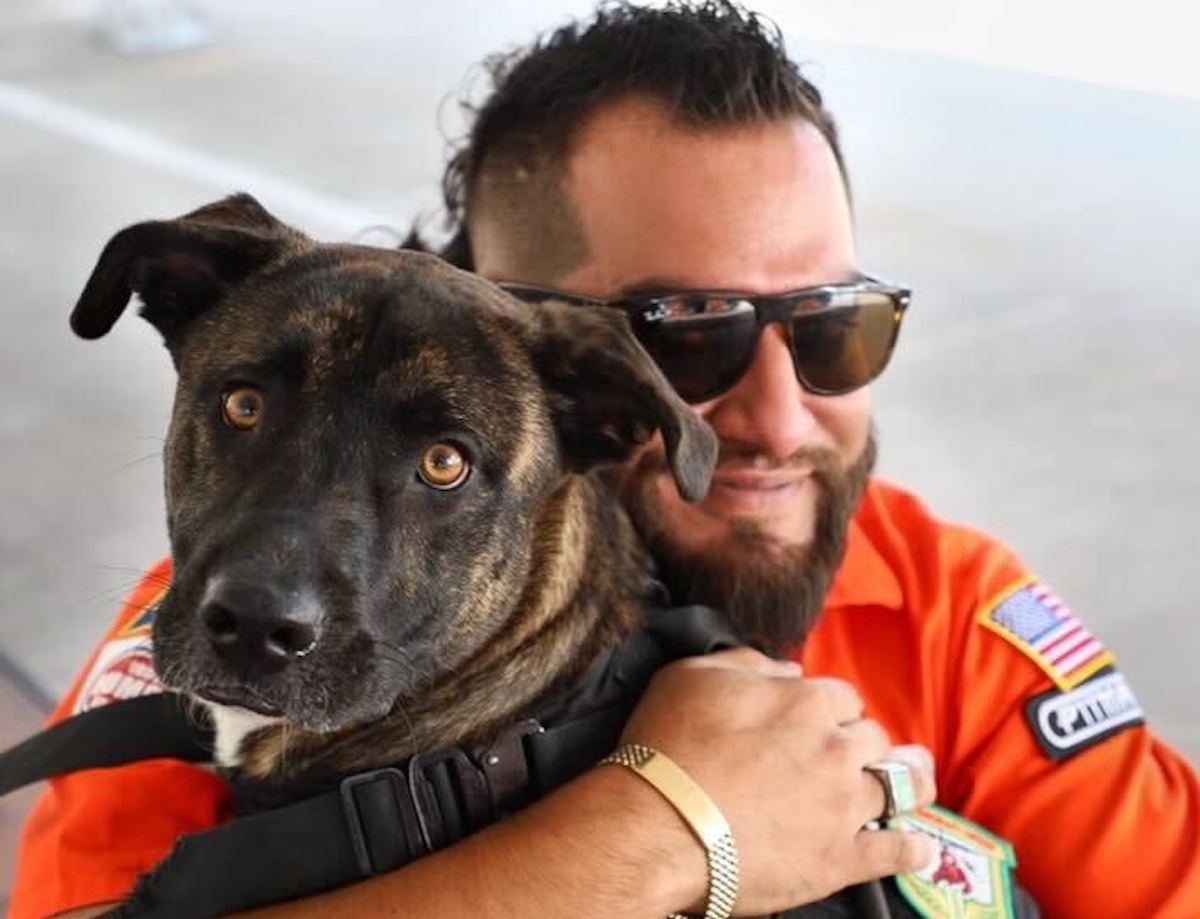 Arash Kharat-J-B-M BBQ - DiningOut Houston Arash Kharat, pitmaster of J-Bar-M BBQ and his dog, Roscoe, embrace. | Photo courtesy of Arash Kharat