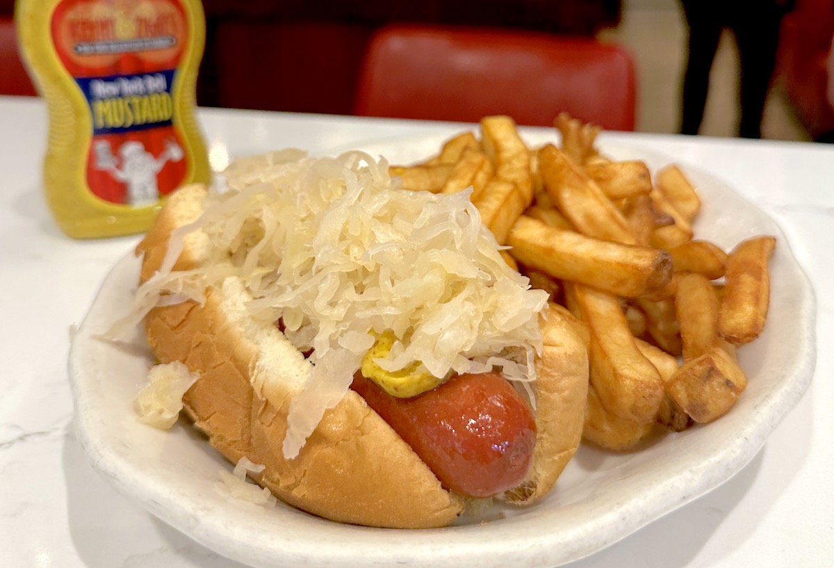 All-beef hot dog with sauerkraut at Kenny & Ziggy's. | Photo by Kenny & Ziggy's