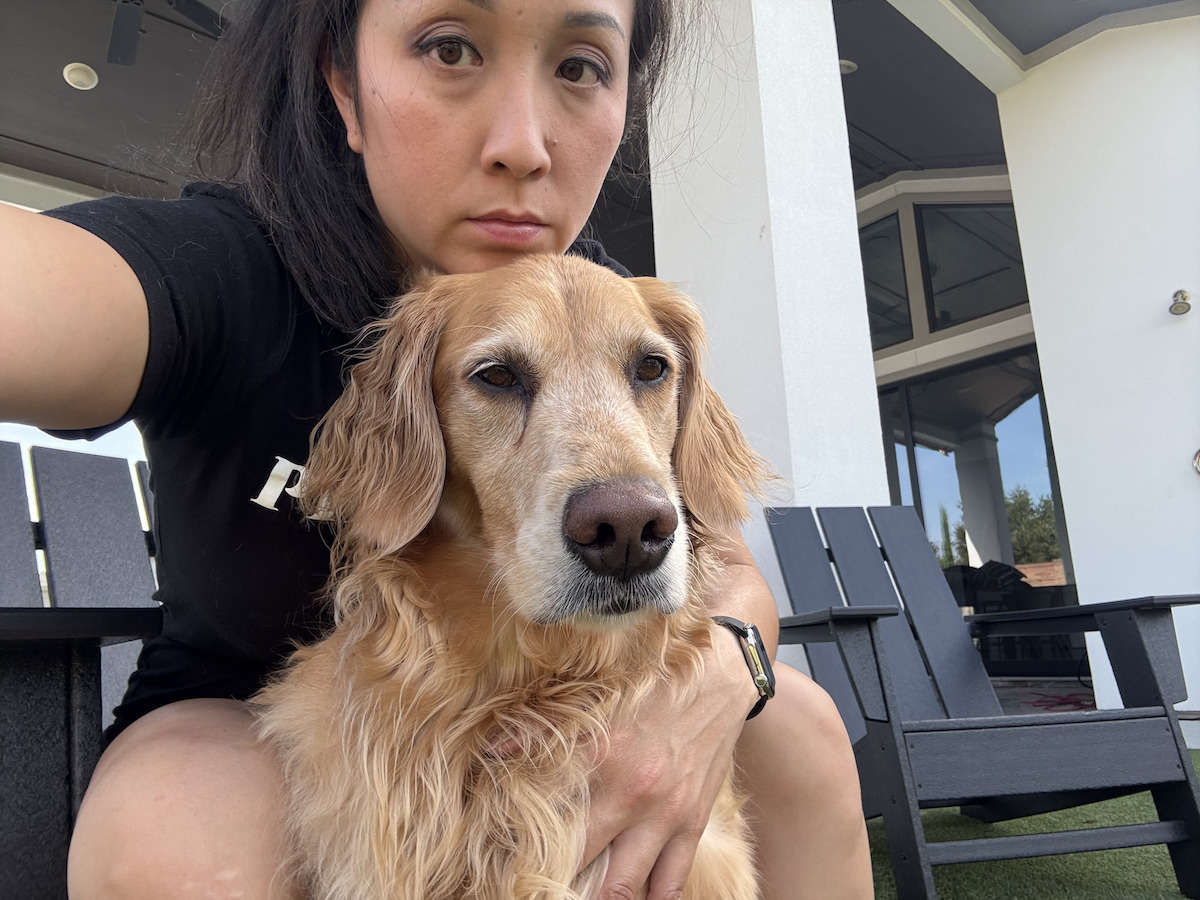 Julie Nguyen-Crawfish Cafe Ocean Palace Pho Prime - DiningOut Houston Julie Nguyen, co-owner of Crawfish Cafe, Ocean Palace, and Pho Prime with her golden retriever Milo. | Photo courtesy of Julie Nguyen