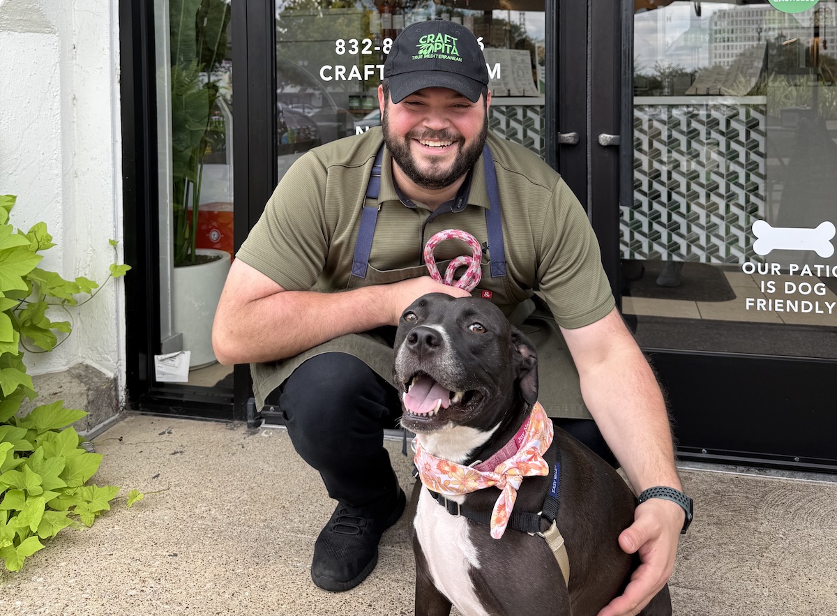 Raffi Nasr-Craft Pita - DiningOut Houston Raffi Nasr, chef and owner of Craft Pita, smiles with his pitbull Joy. | Photo courtesy of Raffi Nasr