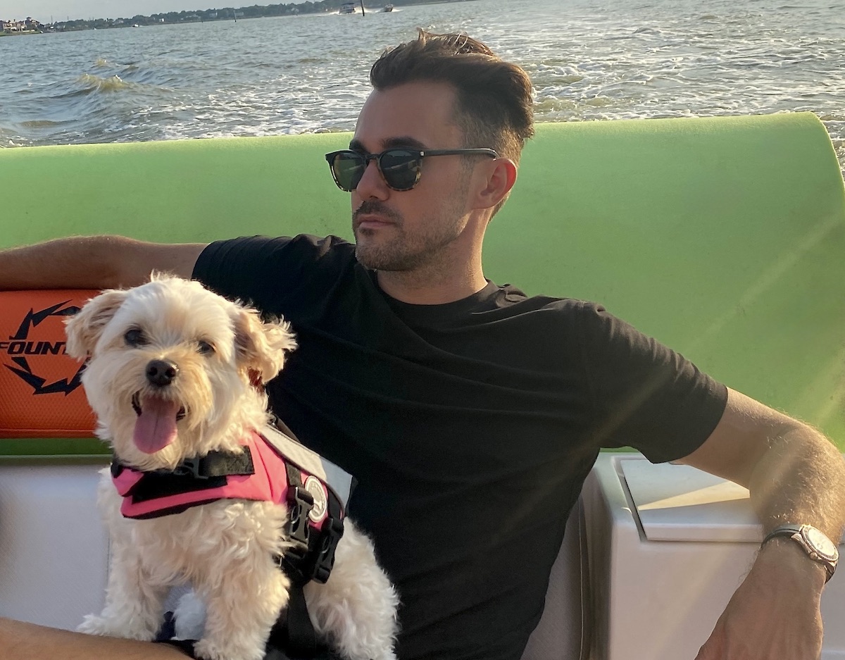 Raz Halili-Pier 6 copy - DiningOut Houston Raz Halili of Pier 6 Seafood & Oyster House in San Leon and Fish Company Taco in Galveston with his dog, Zoe. | Photo courtesy of Raz Halili