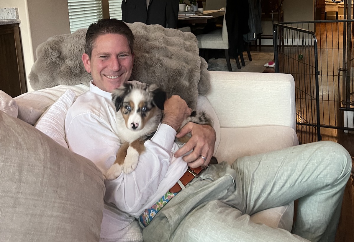 Shawn Virene-Succulent aBouzy - DiningOut Houston Shawn Virene, owner of Succulent Fine Dining and a'Bouzy, poses with his Australian Shepherd puppy, Nido. | Photo courtesy of Shawn Virene