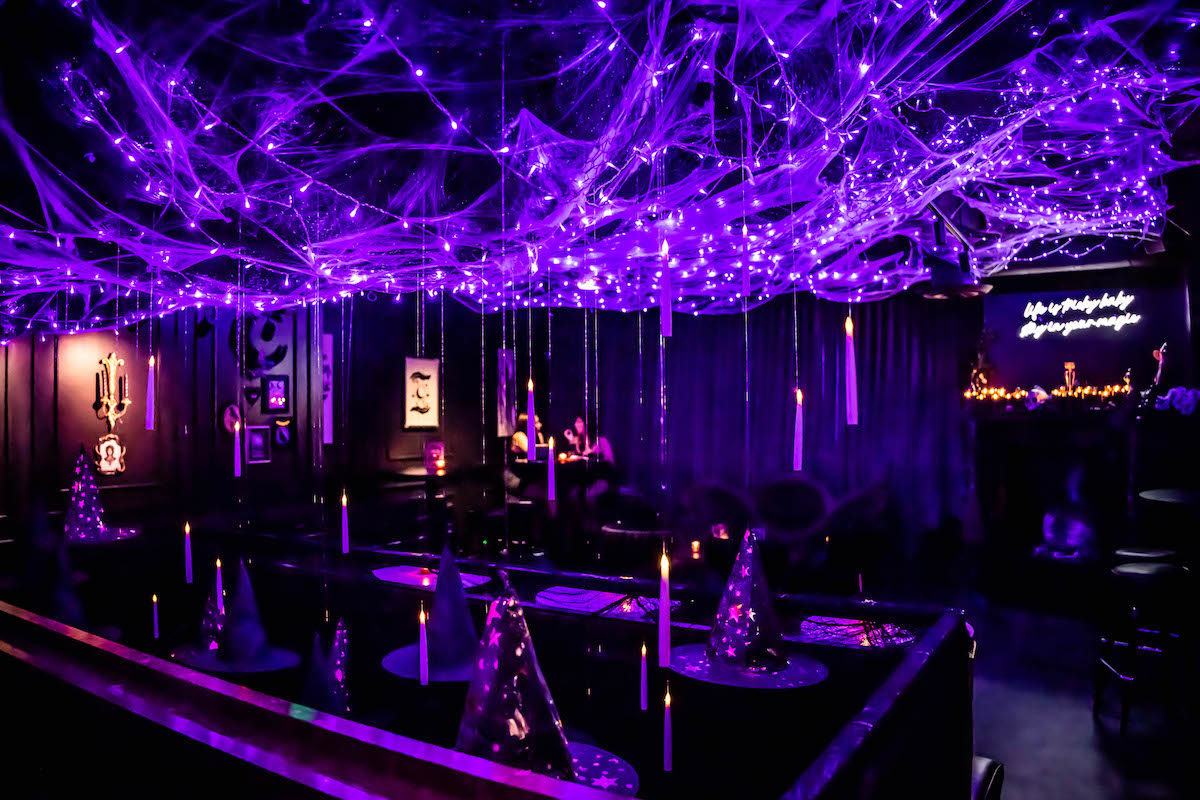The dark and moody decor at the Cursed Cauldron pop-up inside Botanica. | Photo by Christina Griffin