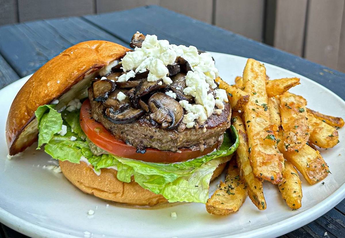 A beef burger topped with mushrooms and feta cheese at Southern Yankee Crafthouse. | Photo by Southern Yankee Crafthouse