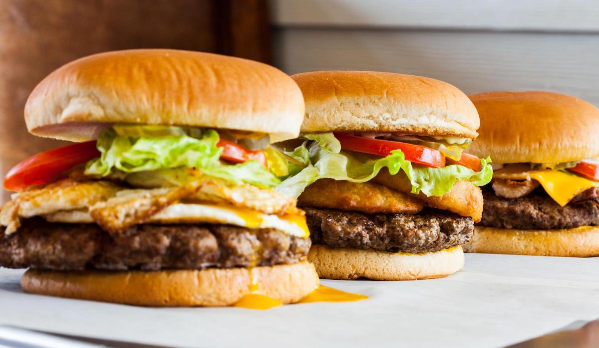 Southwell's burgers with toppings like bacon, egg, and onion rings. | Photo by Southwell's